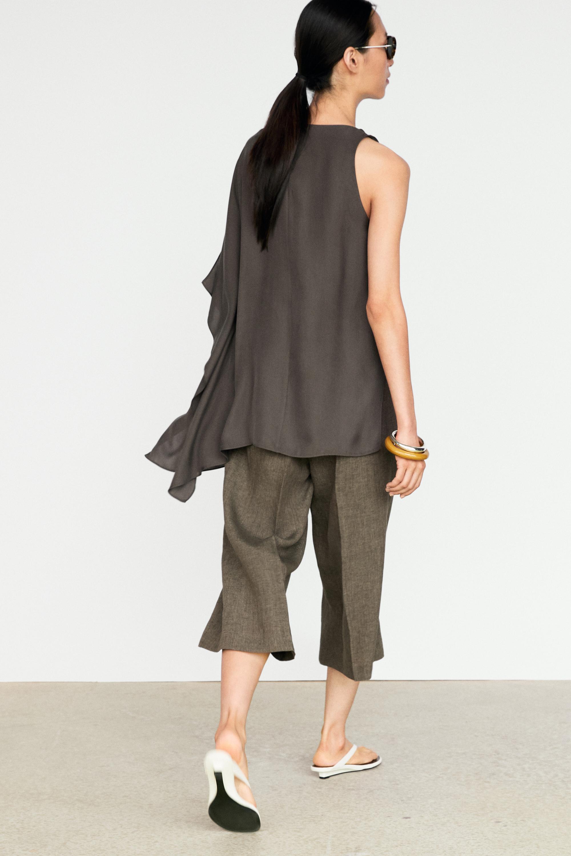 Asymmetric flowing cape top